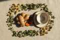 Natural roots and herbs for tea with ceramic cup and saucer
